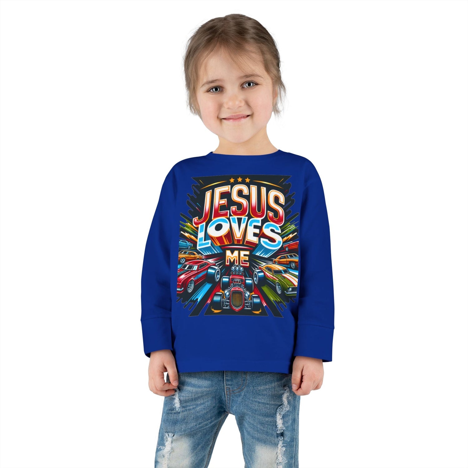 Little girl wearing a “Jesus Loves Me” Christian t-shirt with colorful cars design – Divine Faith Armor™ children’s apparel.