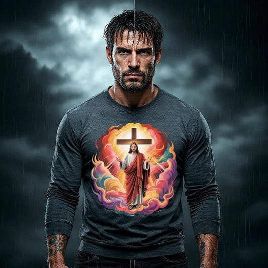 “Jesus with Cross Aura Christian T-Shirt featuring Christ with raised hands beside cross in fiery holy-fire colors – Divine Faith Armor™ Collection” Man wearing a t-shirt with a colorful design of a figure in a robe and cross, set against a dark, cloudy sky.